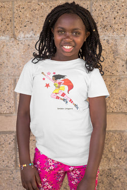 Brown girl wearing a white shirt with illustration of a Brown girl superhero