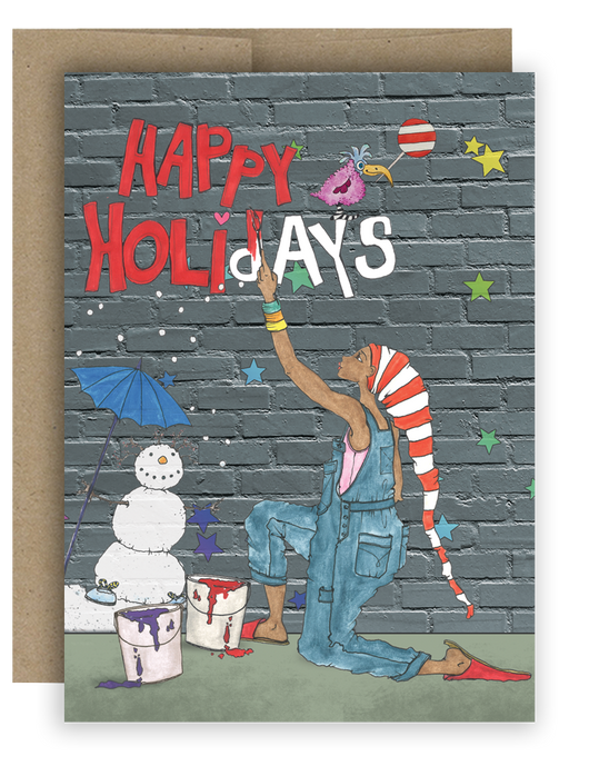 Happy Holidays Notecard featuring a Brown girl artist painting Happy Holidays on a gray brick wall.